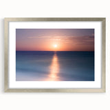 Textured abstract art print of Cancun scenery in muted blue and green tones, framed in silver, ideal for bedroom art.