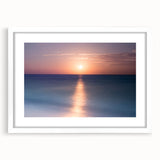 Abstract art print of Cancun scenery in muted blue and green tones, framed with a white mat, suitable for dining room decor.