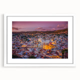 Abstract art print of Guanajuato scenery in vibrant colors on a white framed mat, ideal for dining room decor.