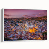Vintage poster art of Guanajuato, Mexico, depicted in colorful hues on a large framed canvas, suitable for living room decor.