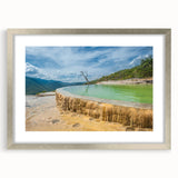 Textured abstract art print of Oaxaca scenery in muted earth tones, framed in silver, ideal for bedroom art.
