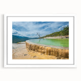 Abstract art print of Oaxaca scenery in muted earth tones on a framed white mat, suitable for bedroom or dining room decor.