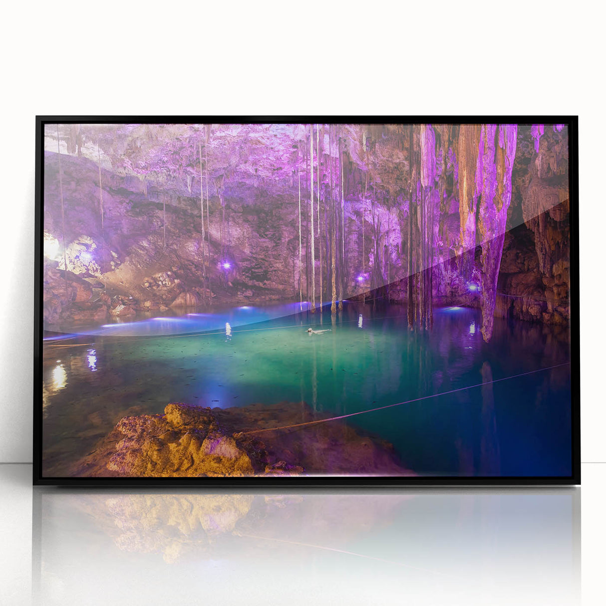 Large abstract wall art depicting a Yucatan scenery in muted earth tones, framed in black acrylic.