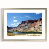 Textured abstract art print depicting a Middle Eastern landscape in earthy tones on a framed canvas.