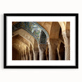 Abstract art print featuring a colorful, textured depiction of a Middle Eastern scenery, framed in black.