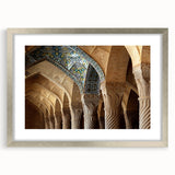 Textured abstract art print depicting a Middle Eastern scenery in muted earth tones, framed in silver, ideal for bedroom art.