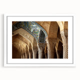 Abstract art print of Middle Eastern scenery in muted earth tones, framed in white, ideal for dining room decor.