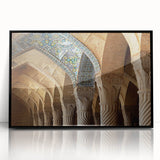 Large abstract wall art depicting a stylized Middle Eastern landscape in muted earth tones, framed in black acrylic.