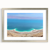 Textured abstract art print depicting the Dead Sea in muted blue and gray tones, framed in silver, suitable for bedroom art.
