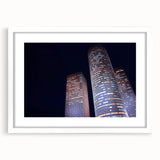 Abstract art print of Tel Aviv skyline in muted blue and white tones, framed with a white mat, ideal for dining room decor.