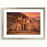 Textured art print of an abstract Jordanian landscape in muted earth tones, framed in silver, ideal for bedroom decor.