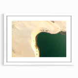 Abstract art print of a Middle Eastern desert scene in muted earth tones on a white-framed canvas.