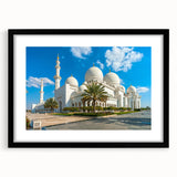 Abstract art print of Abu Dhabi skyline in vibrant colors on a large black framed canvas, ideal for living room decor.