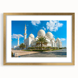 Extra large abstract art print of Abu Dhabi skyline in muted gold and beige tones on framed canvas.