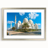 Textured abstract art print of a muted blue and grey Emirates skyline on a framed silver mat, suitable for bedroom decor.