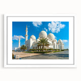 Abstract art print of Abu Dhabi skyline in muted gray and blue tones on a framed white mat, ideal for dining room decor.