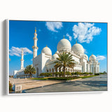 Framed canvas of vintage poster art featuring a colorful Abu Dhabi skyline on a white background.