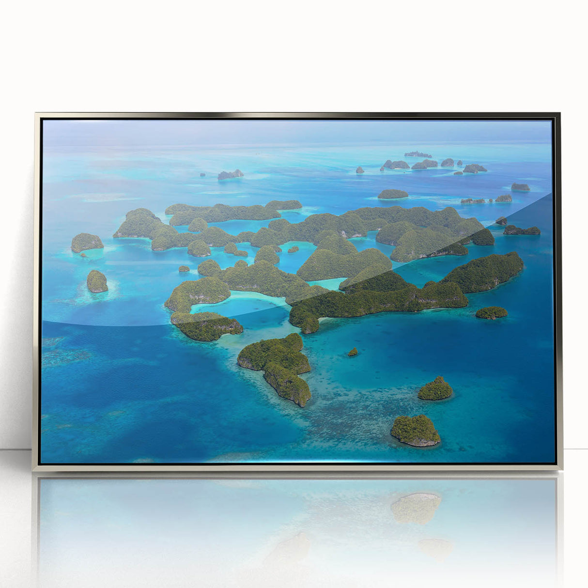 Mid-century modernist art of an abstract oceanic scene, in muted blues and greens, acrylic print framed in silver.