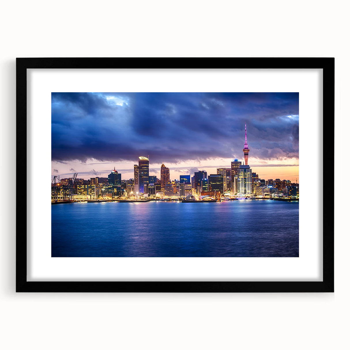 Extra large abstract art print depicting vibrant, colorful Auckland skyline on textured canvas, framed in black.
