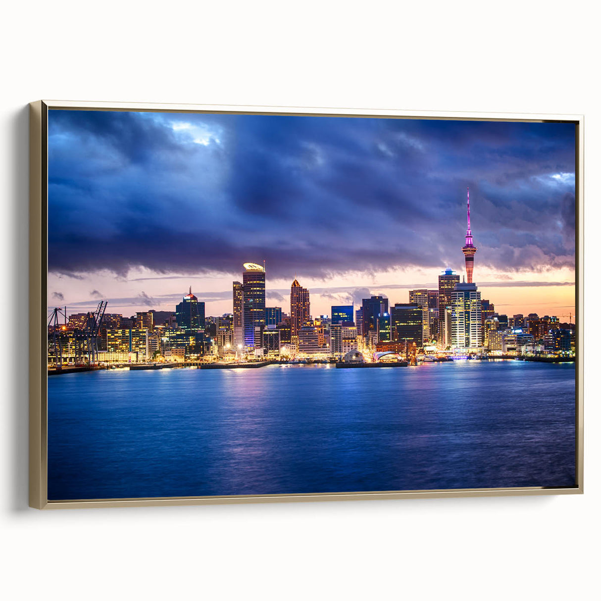 Framed canvas wall art featuring a vintage-style landscape painting of Auckland, with a dominant black and gold color scheme.