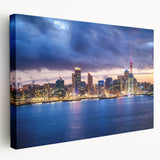 Large stretched canvas depicting Auckland skyline in muted blues and grays, suitable for kitchen wall art.