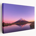 Side view of a stretched canvas depicting Taranaki, New Zealand with lush greenery and calm blue skies.