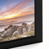 Extra large framed canvas depicting a textured black coastal scenery with colorful accents, ideal for living room decor.