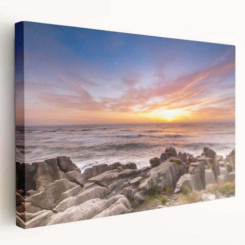 Large wall art on stretched canvas depicting the rugged West Coast of New Zealand in soft gray and blue tones.