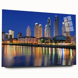 Large abstract wall art of Buenos Aires skyline in muted gray and blue tones on acrylic glass.
