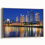 Framed canvas wall art of a vintage-style Buenos Aires landscape in black and gold tones, ideal for bedroom decor.