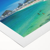 Art deco poster featuring a stylized illustration of Rio de Janeiro in vibrant colors on rolled canvas.