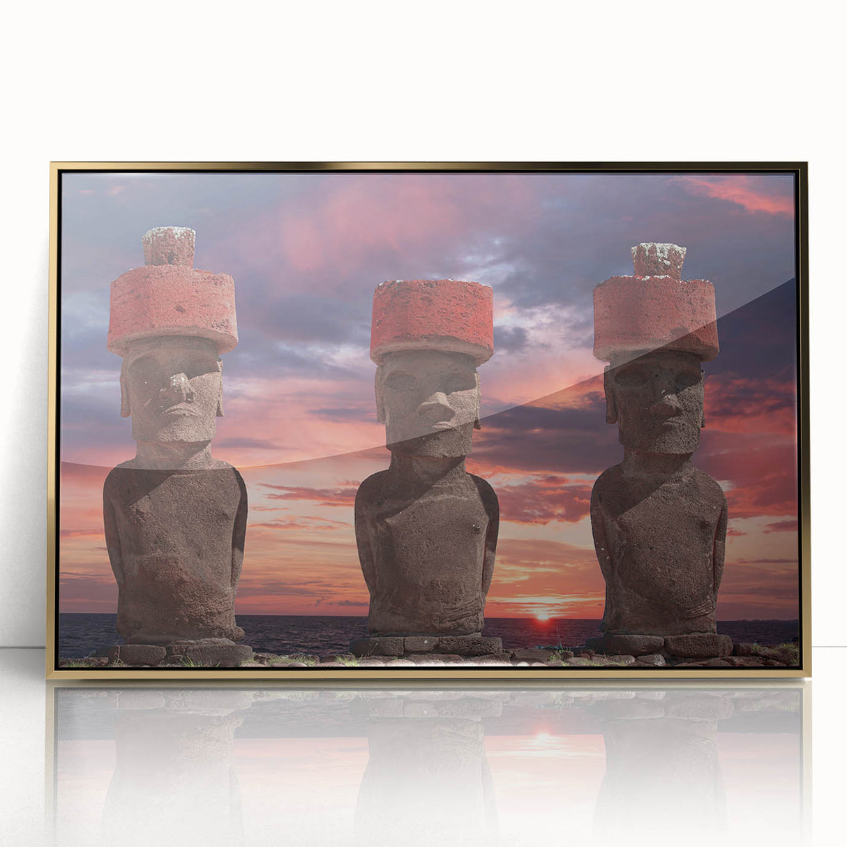 Acrylic print of Easter Island statues in muted earth tones, framed in gold, suitable for modern art wall decor.