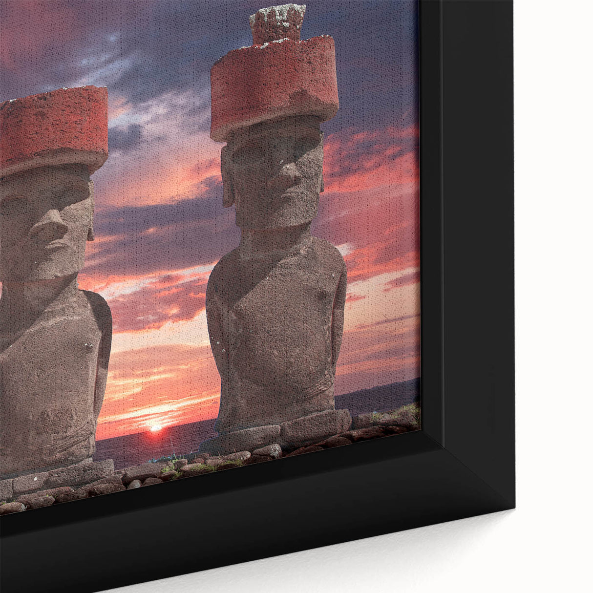 Close-up of a black framed canvas featuring textured, colorful art of Easter Island scenery, ideal for living room decor.