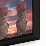 Close-up of a black framed canvas featuring textured, colorful art of Easter Island scenery, ideal for living room decor.