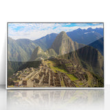 Acrylic print of Machu Picchu in muted green and brown tones, framed in white, suitable for modern art wall decor.