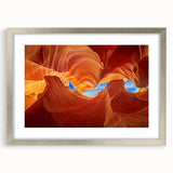 Textured art depicting abstract Arizona Antelope Canyon in muted orange and brown tones on a framed silver mat.
