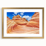 Extra large abstract art print depicting the textured Coyote Buttes in Arizona, in a gold frame with mat.