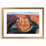 Extra large abstract art print of Arizona's Glen Canyon in textured gold frame, ideal for living room ambiance.