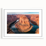 Abstract art print of Glen Canyon in muted earth tones on a framed white matte, suitable for dining room decor.