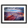 Colorful abstract art print of the Grand Canyon in vibrant hues on a large textured canvas, ideal for living room decor.
