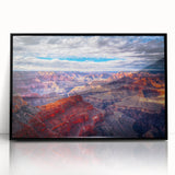 Large abstract wall art of the Grand Canyon in muted earth tones, framed in black acrylic.