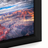 Framed canvas depicting a textured view of the Grand Canyon in black with vibrant, colorful accents.