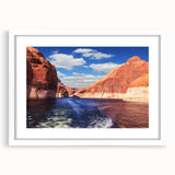 Abstract art print of Lake Powell in muted blue and tan hues on a framed white mat, ideal for bedroom or dining room decor.