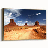 Framed canvas featuring Monument Valley landscape in muted gold and black tones, suitable for bedroom wall art.
