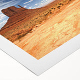 Art deco poster of Monument Valley in muted earth tones on rolled canvas, suitable for dining room decor.