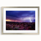 Textured art print of Sonoran Desert landscape in muted earth tones, displayed in a silver frame with mat.