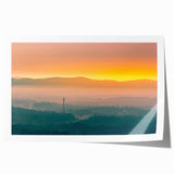 Rolled print of Arkansas scenery featuring muted green and brown floral designs.