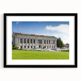 Colorful abstract art print of textured scenery, displayed in a black frame with mat, ideal for living room decor.