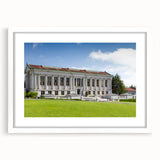 Abstract art print of Berkeley scenery in muted blue and green tones on a framed white mat, suitable for dining room decor.