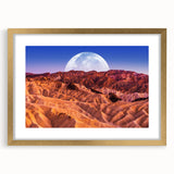 Extra large abstract art print of Death Valley in muted earth tones on a textured canvas, framed in gold.